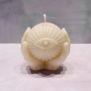 Hand Holding an Eye Bees Wax Candle